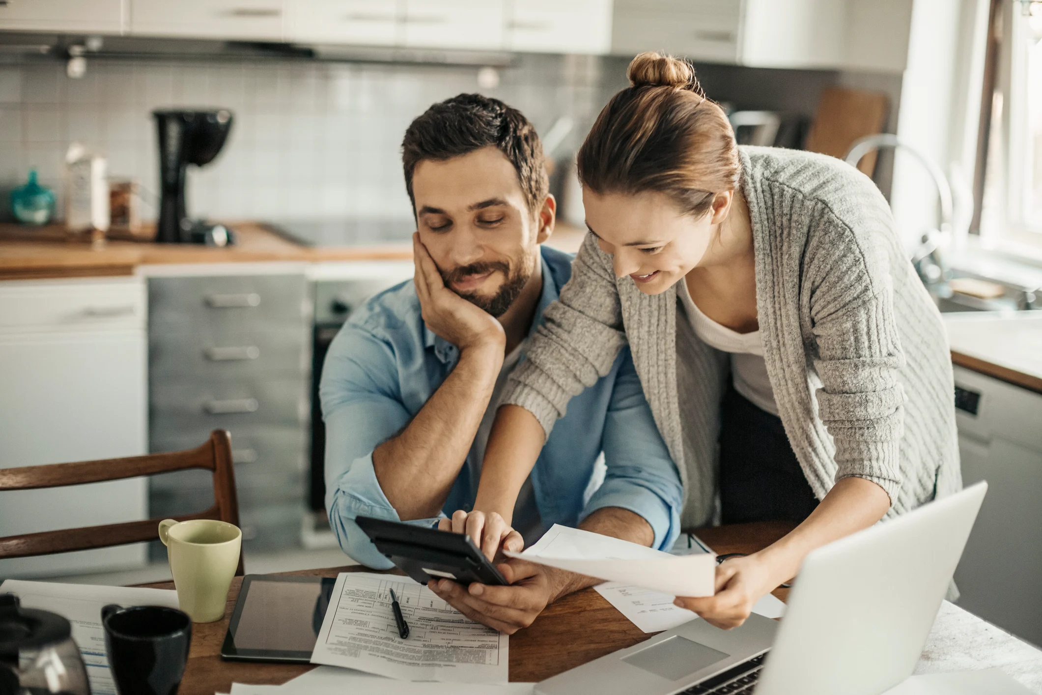 A couple reviewing their finances together at home